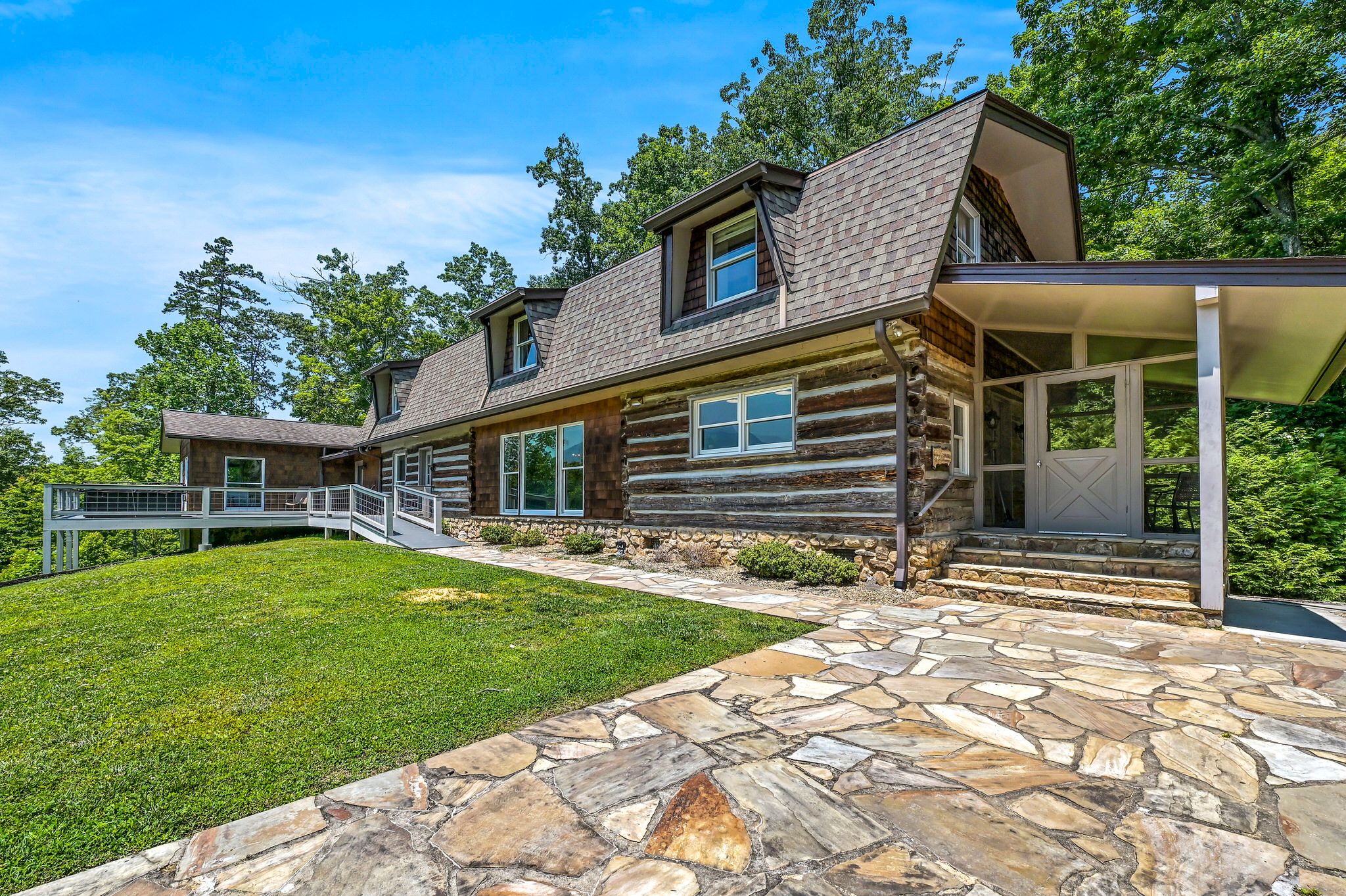Exterior of cabin lodge rental with ramp leading to front door