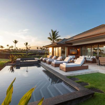 Pool and lounge area with sunset view