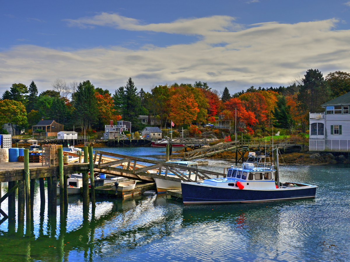 View of Boothbay Harbor surrounded by Fall foliage