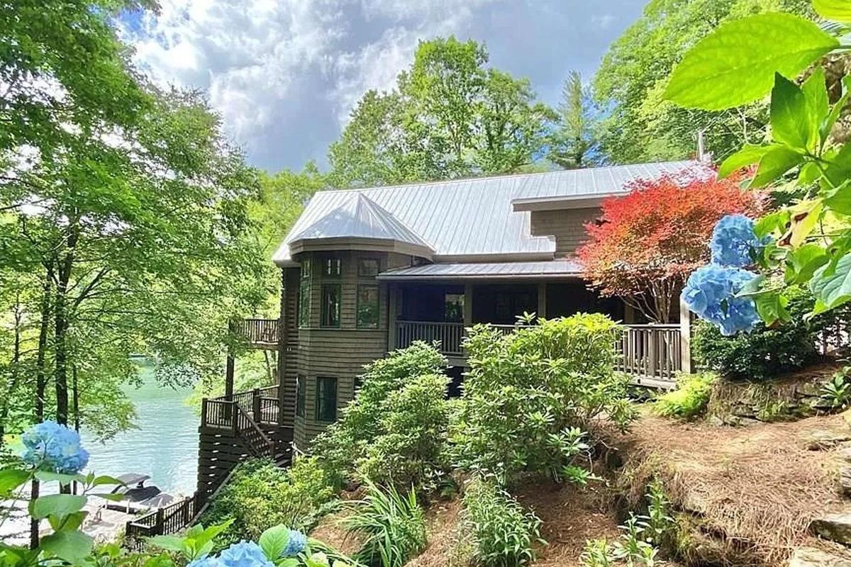 Trail and lake view of house