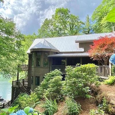 Trail and lake view of house