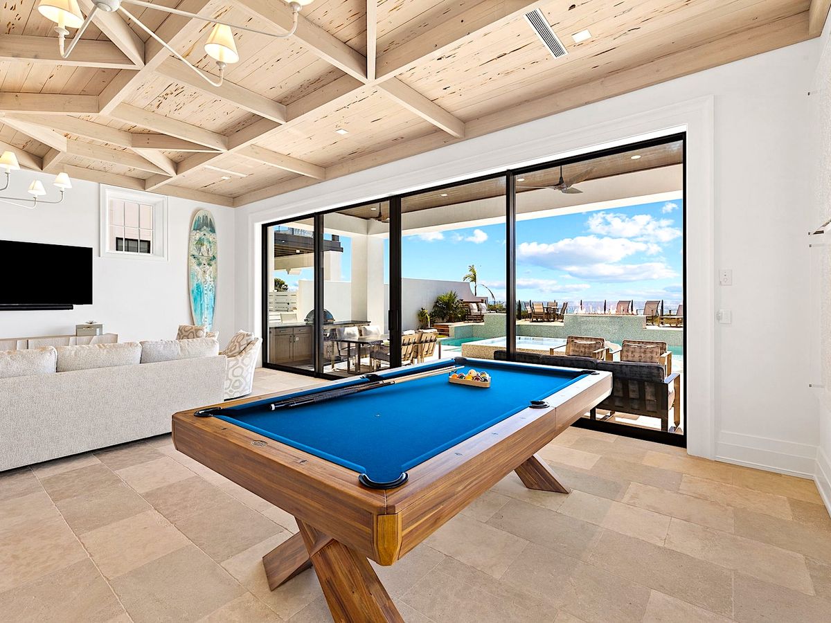 Game Room With Pool Table and View of Pool In A Luxury 30A Vacation Rental