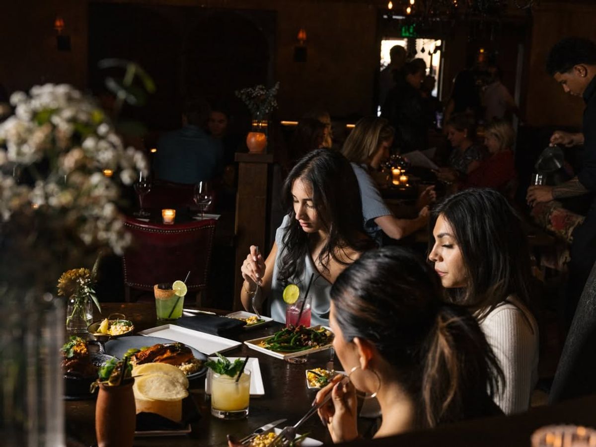 Guests enjoy candlelit dining and craft cocktails at The Mission in Scottsdale. The dark interior and stylish decor create a warm, upscale atmosphere. It’s one of the best restaurants in Scottsdale for modern Latin cuisine.