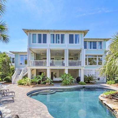 Exterior view of a Tybee Island vacation rental with a private pool.