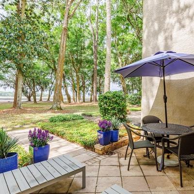 Patio With Seating, Flowers and View of Golf Course at an Amelia Island, FL Vacation Rental