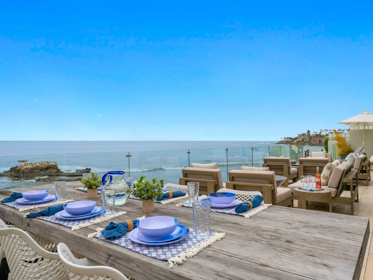 A peaceful ocean scene with kayakers and sea lions just off the coast of La Jolla. Sea Glass La Jolla brings you close to nature while staying just steps from the sea.