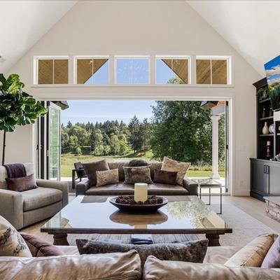 Living room with accordion-style access to outdoors in Pearl of The Valley.