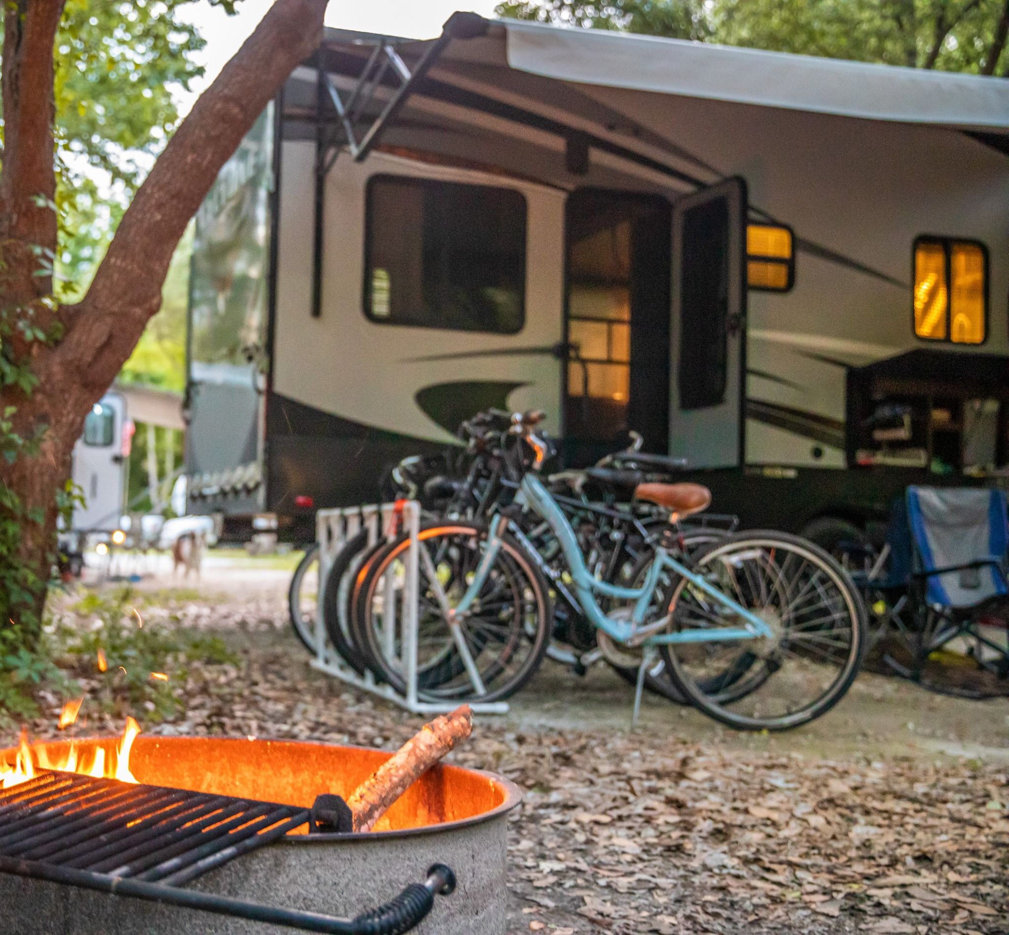A camper setup at James Island County Park with bikes and a campfire area. This park is popular for camping, biking, and outdoor fun close to Charleston.