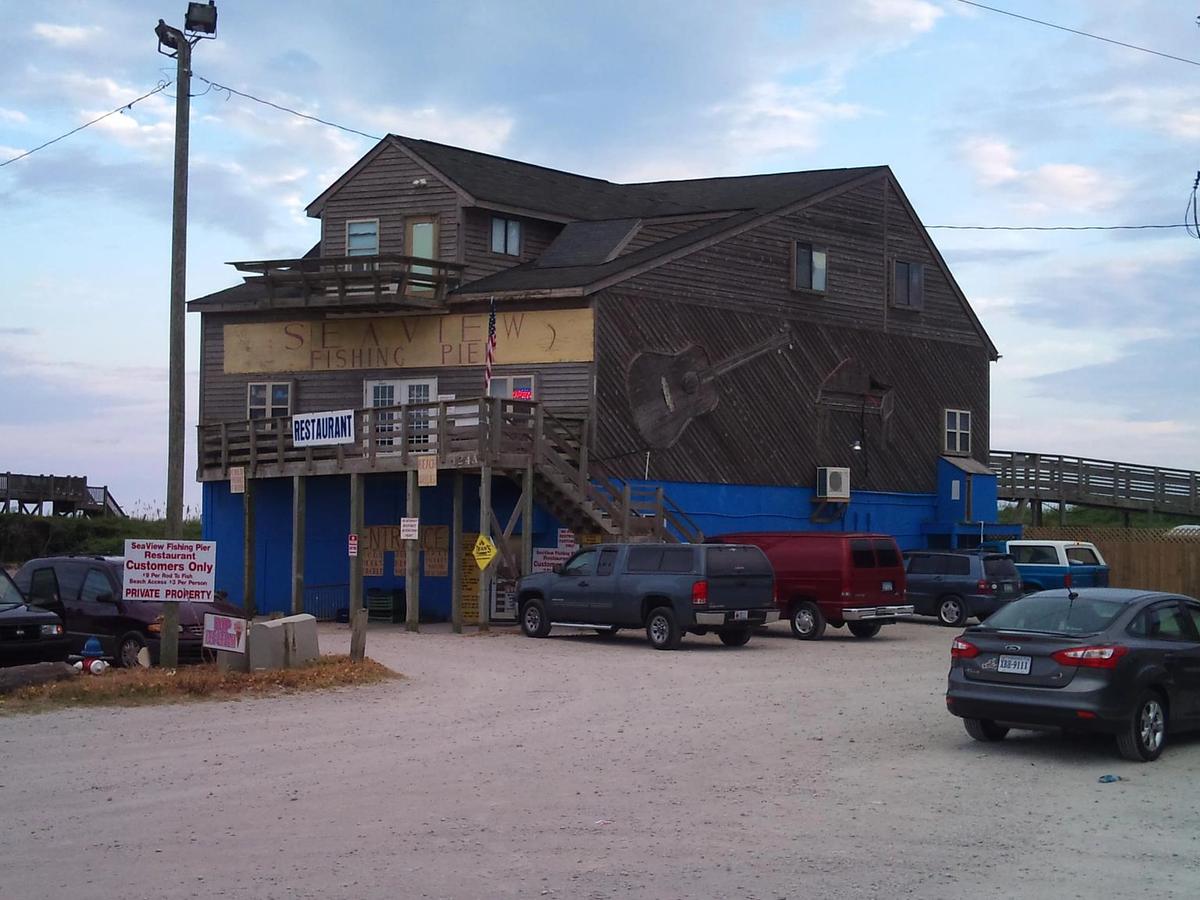 SeaView Fishing Pier stands tall with a rustic beach-town vibe, offering fishing, food, and fun. Locals and visitors love this laid-back spot for its charm and fresh seafood.