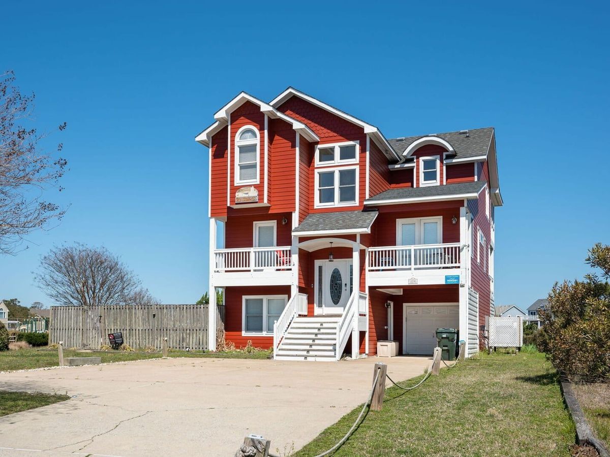 With beach access and a private pool, this spacious Outer Banks home is ideal for dog-friendly getaways. Enjoy multiple decks, a game room, and access to community amenities like a fitness center and playground.