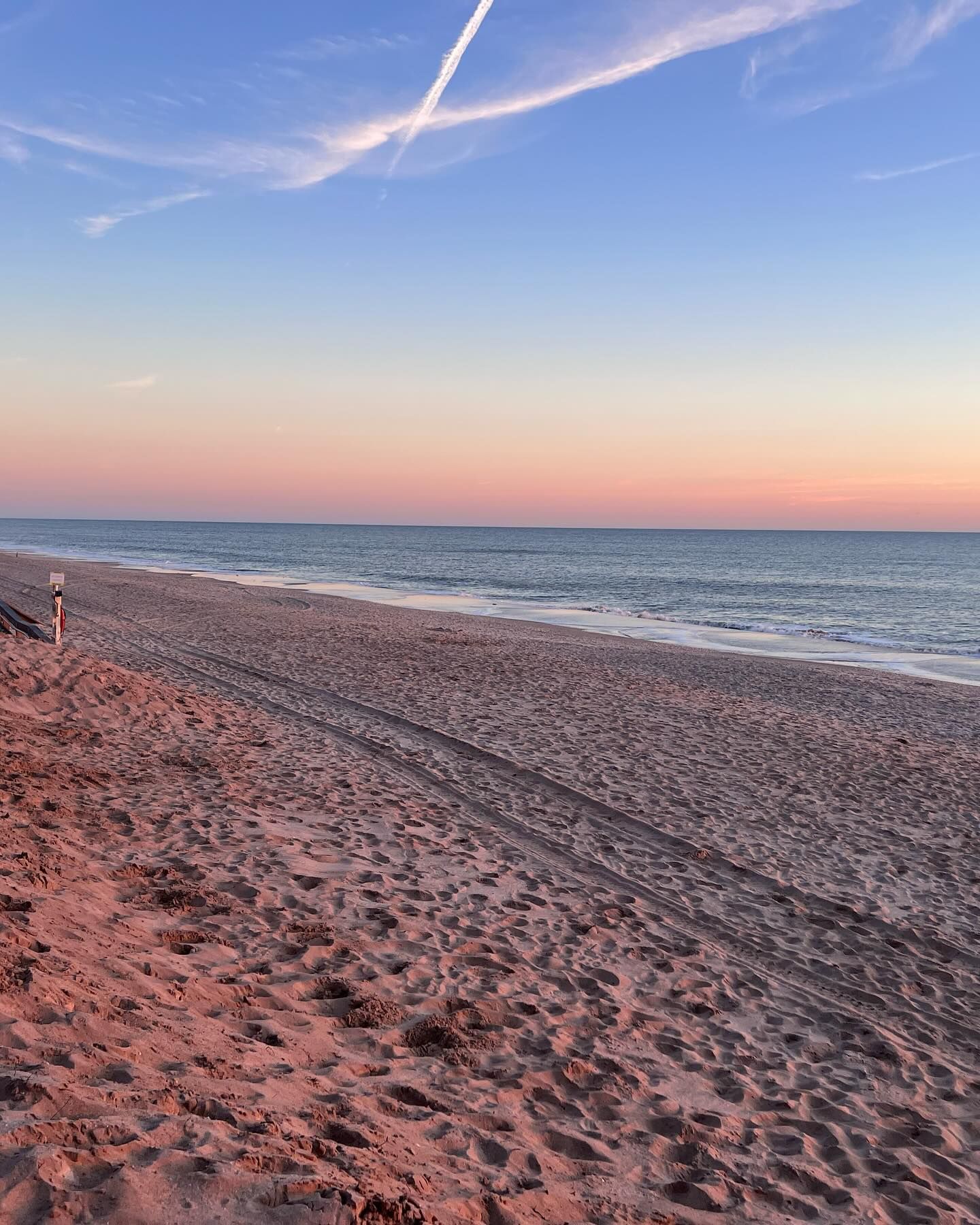Jet skis race across bright blue waters under a sunny sky near a lush shoreline and distant bridge. The scene captures the fun, freedom, and natural beauty of Satellite Beach’s coastal adventures.
