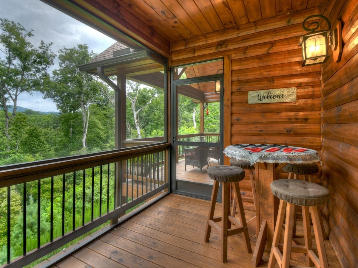 Private table for two with checkers game in the middle of them on screened-in porch