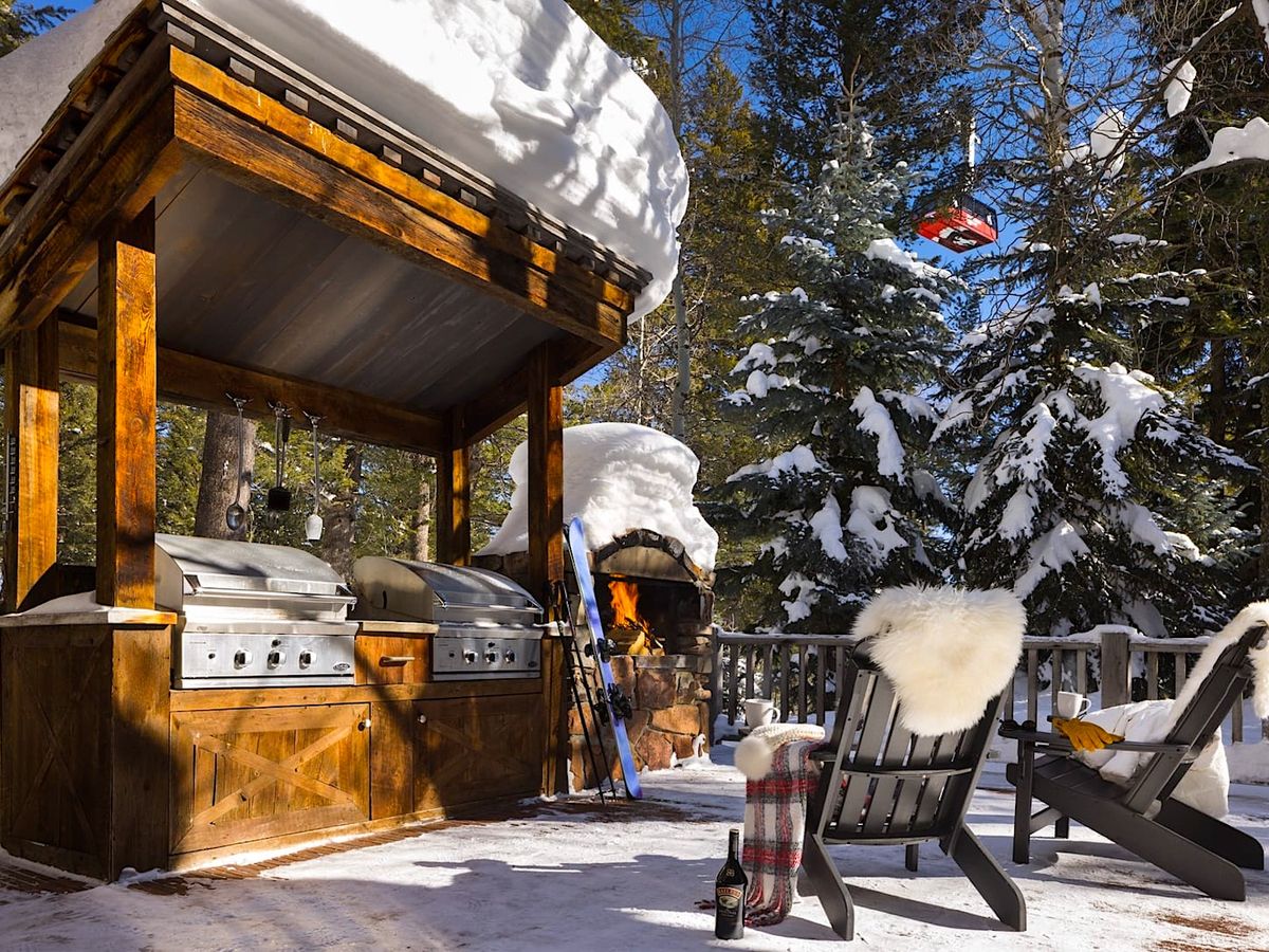 Outside Seating Area with Fireplace At Luxury Jackson Hole Vacation Rental