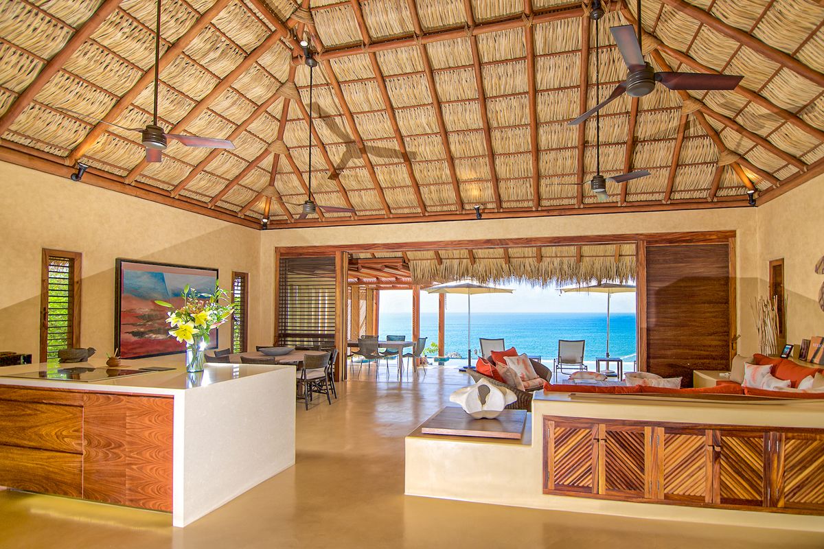 Indoor living space with views of the sea.