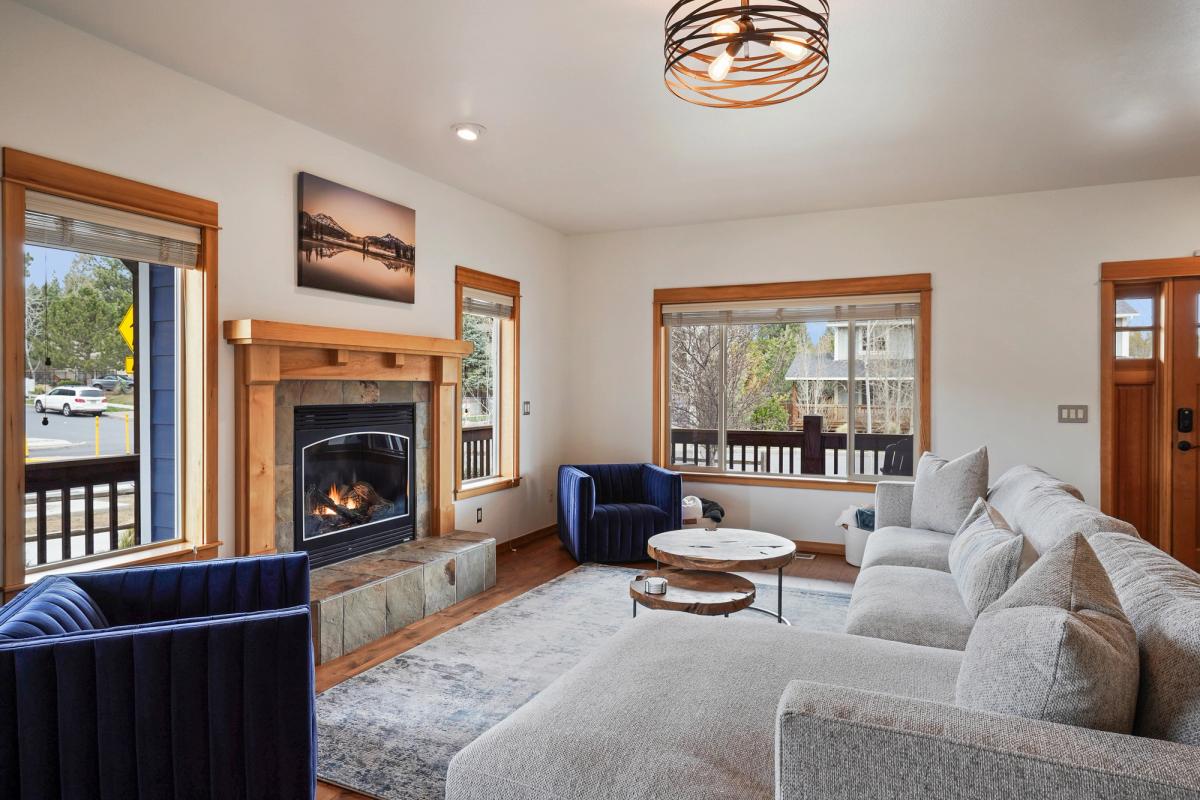 Living room with a fireplace in a Bend, OR vacation rental.