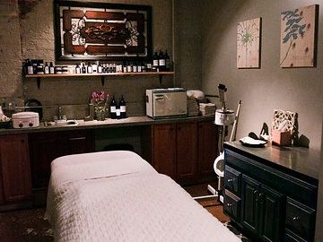 A cozy spa room features soft lighting, a massage table, and soothing décor designed for ultimate relaxation. Guests can indulge in calming treatments that melt away stress and rejuvenate the body