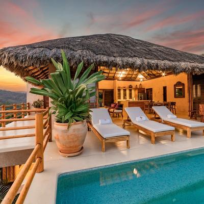 Outdoor living space overlooking the private pool.