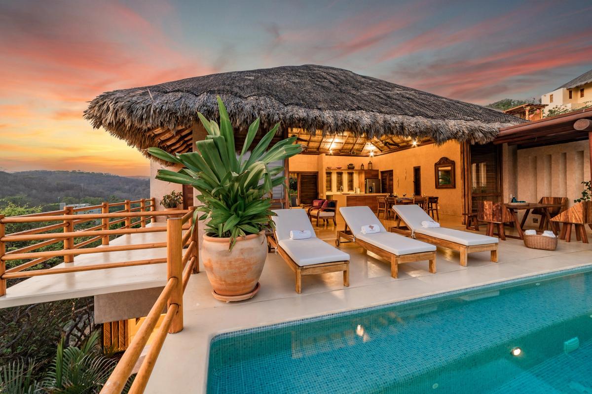 Outdoor living space overlooking the private pool.