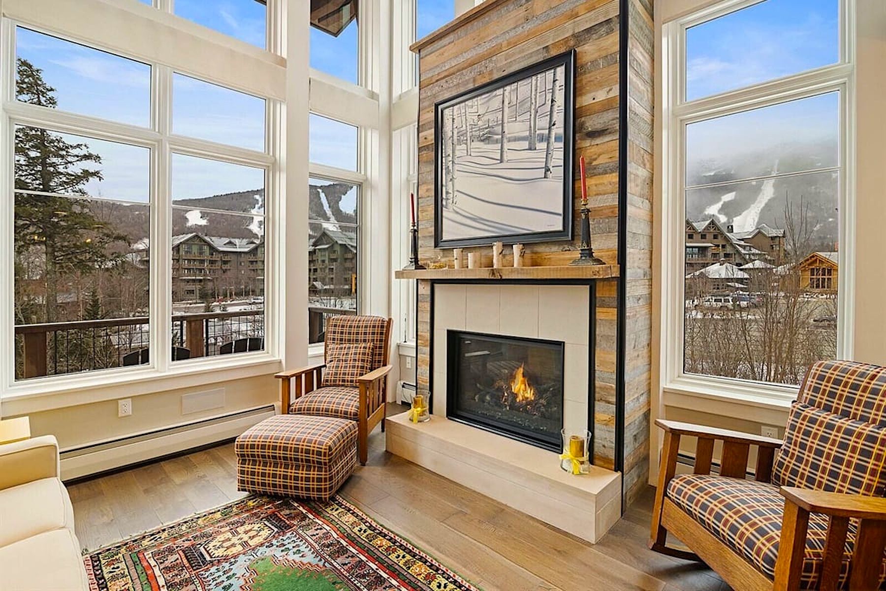 Living Room with Fireplace and View of Mountain in Luxury Walk to Ski Vacation Rental in Stowe