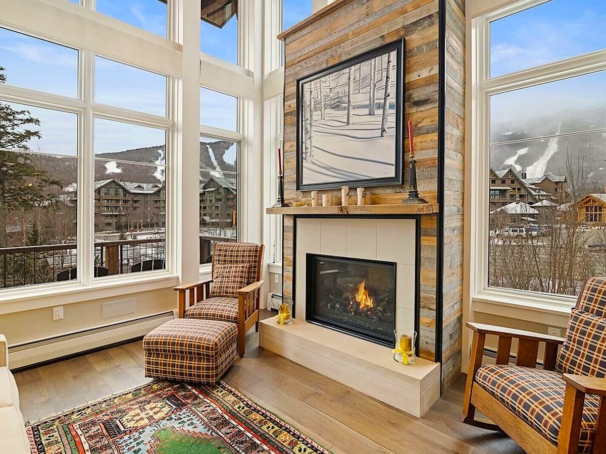 Living Room with Fireplace and View of Mountain in Luxury Walk to Ski Vacation Rental in Stowe