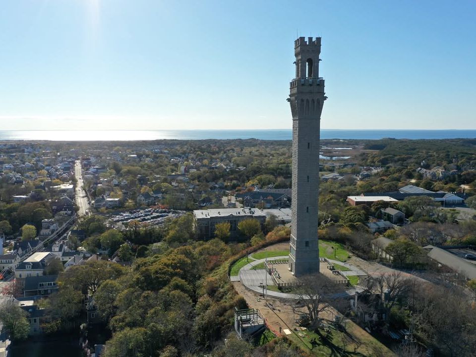 The tall Pilgrim Monument rises above Provincetown, offering sweeping views of Cape Cod and the Atlantic Ocean. Visitors often climb the monument to see the historic town and coastline from above. It is one of the most recognizable landmarks in Cape Cod.