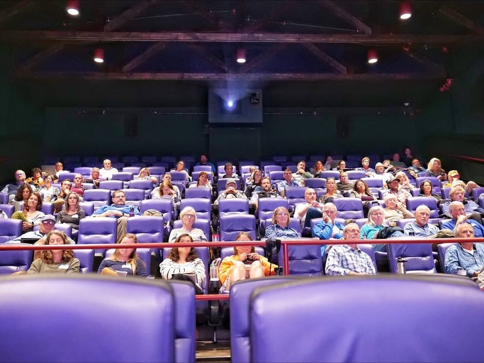 A packed theater of moviegoers enjoys an intimate screening at the Martha’s Vineyard Film Festival. The cozy setting and thoughtful storytelling highlight the island’s appreciation for independent cinema.
