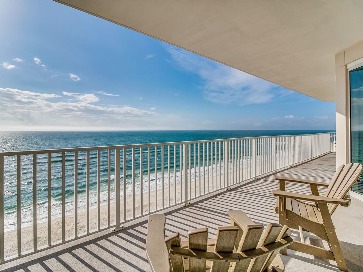 Enjoy endless Gulf views from this wide balcony featuring wooden chairs and open railings. It’s the perfect spot for sunrise coffee or a quiet evening by the ocean breeze.