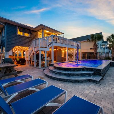 Private pool with outdoor seating at A Boardwalk Away.