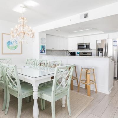 Dining nook and kitchen in a Folly Beach vacation rental.