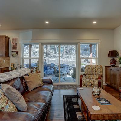 Living room with fireplace in a Bend, OR vacation rental.