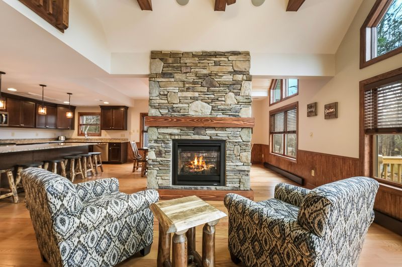 Living room with fireplace at vacation rental home in the Poconos