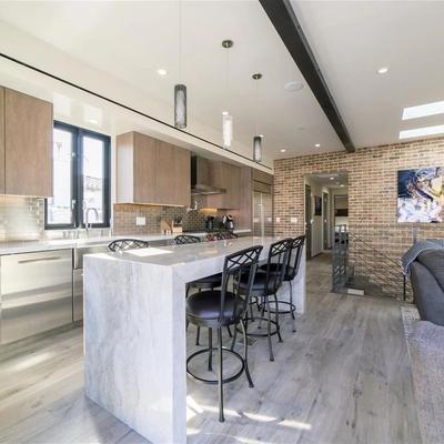 Open living space with gourmet kitchen in a Newport Beach vacation rental.