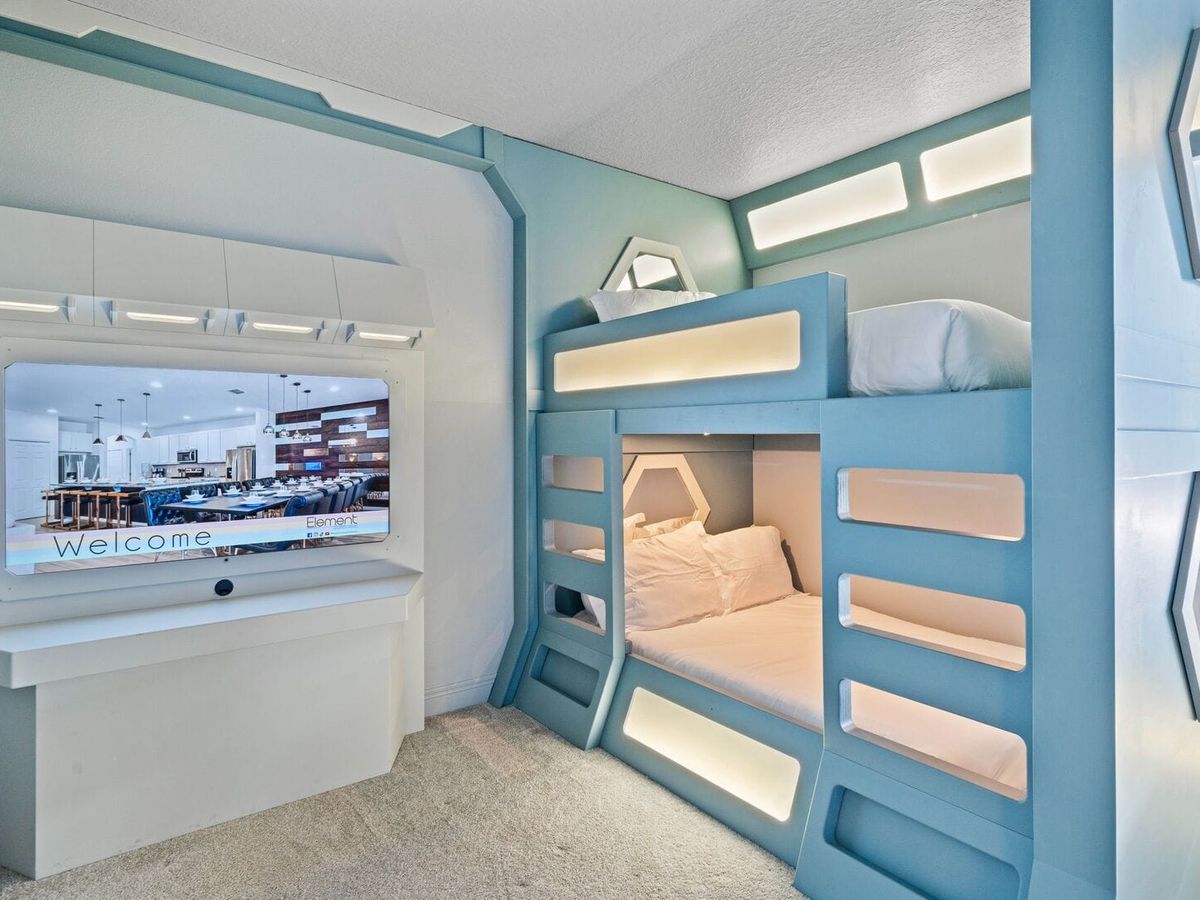 Futuristic-themed bedroom with bunk beds in vacation home