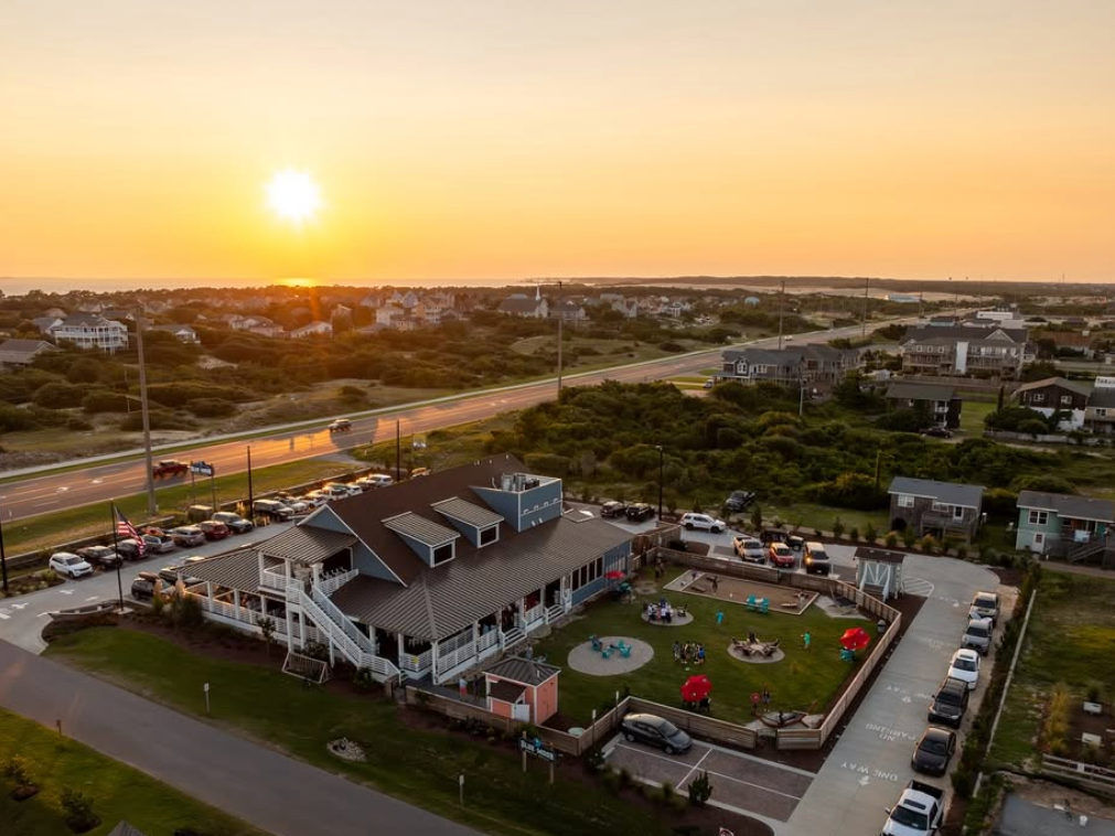 Sunset going down at beach grill with outdoor area