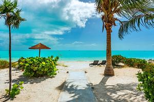 Beach Chairs and Umbrellas on Private Beach in Turks & Caicos