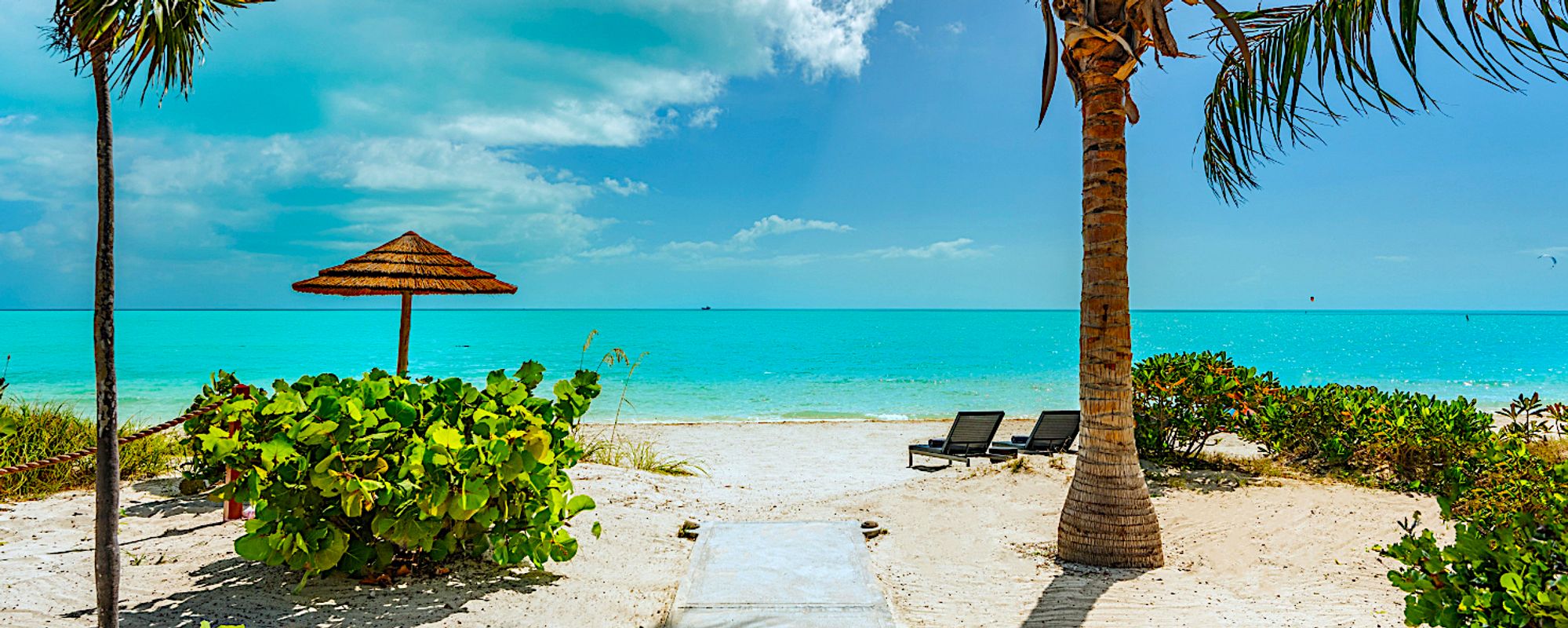 Beach Chairs and Umbrellas on Private Beach in Turks & Caicos