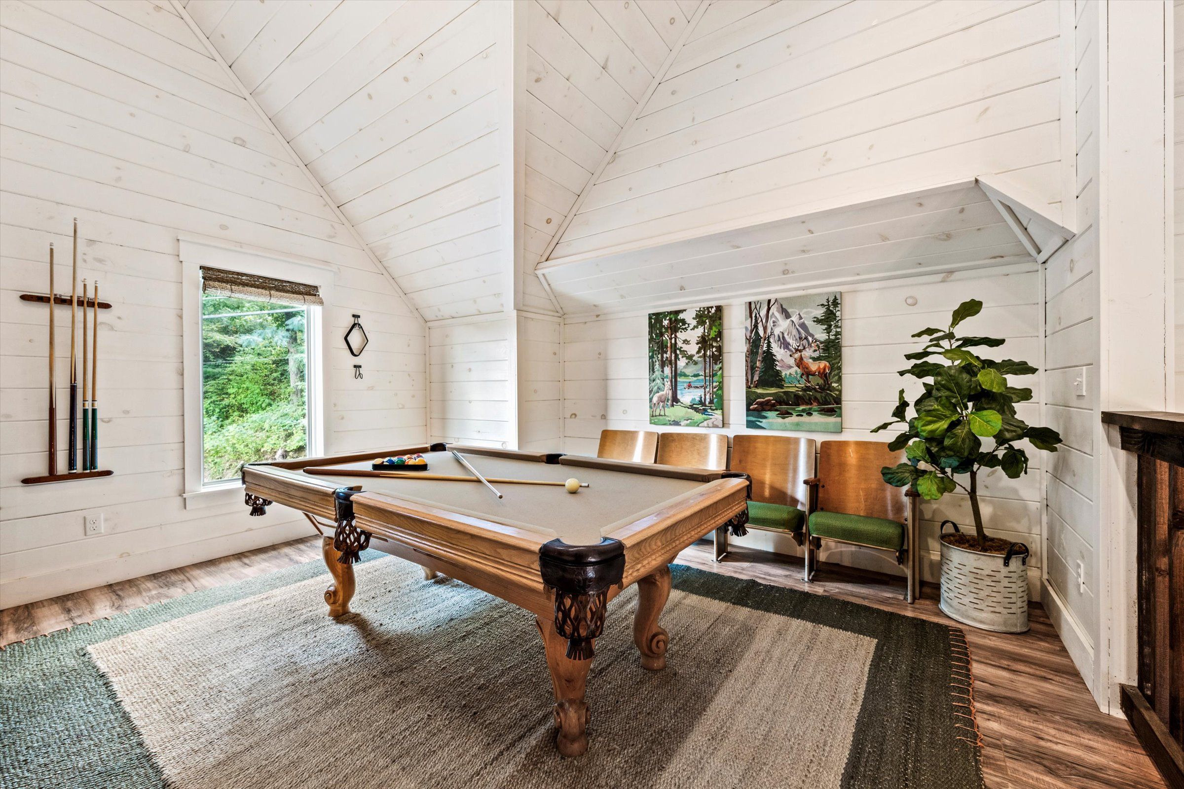 Pool table in game room with cool retro chairs