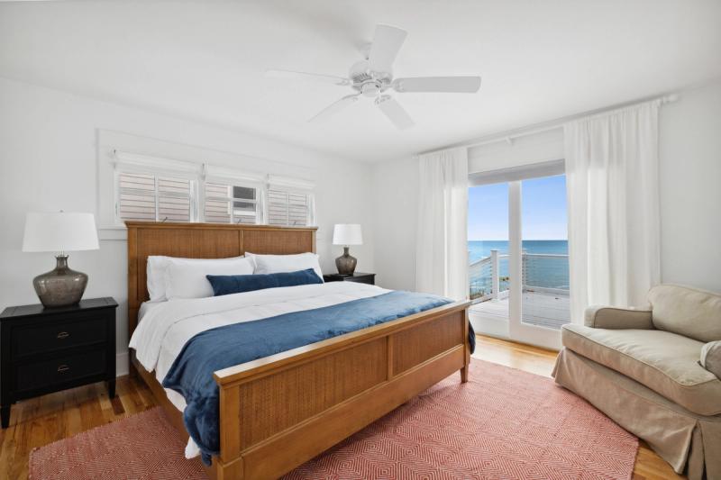 Lakeside views from this bedroom in a Southwest Michigan vacation rental 