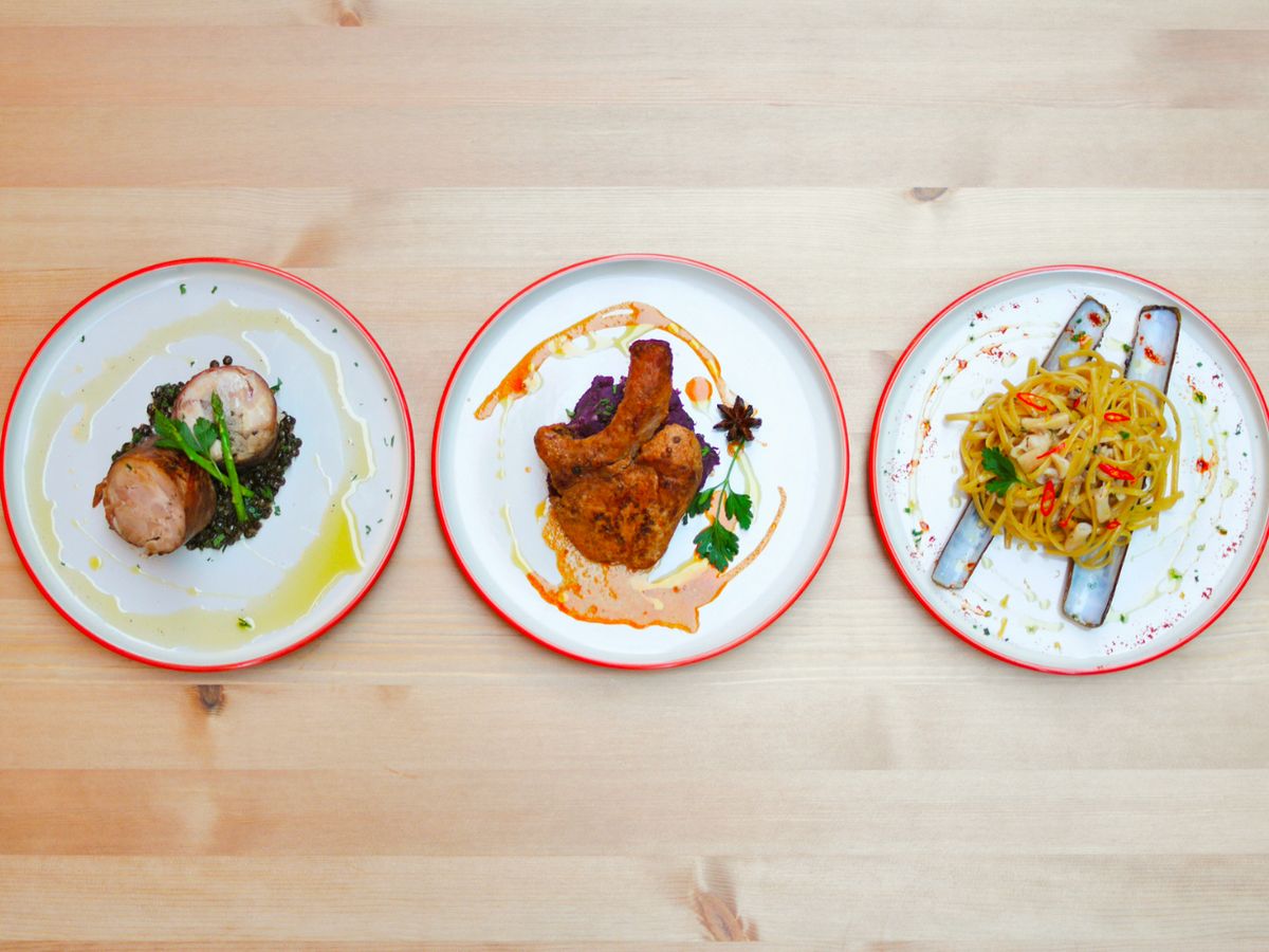 Gourmet Food on White Plates and a Wooden Table