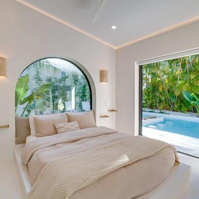 Bedroom with poolside views in Luum at the Shore.