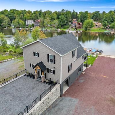 Exterior view of a lakefront Pocono Mountain vacation rental.