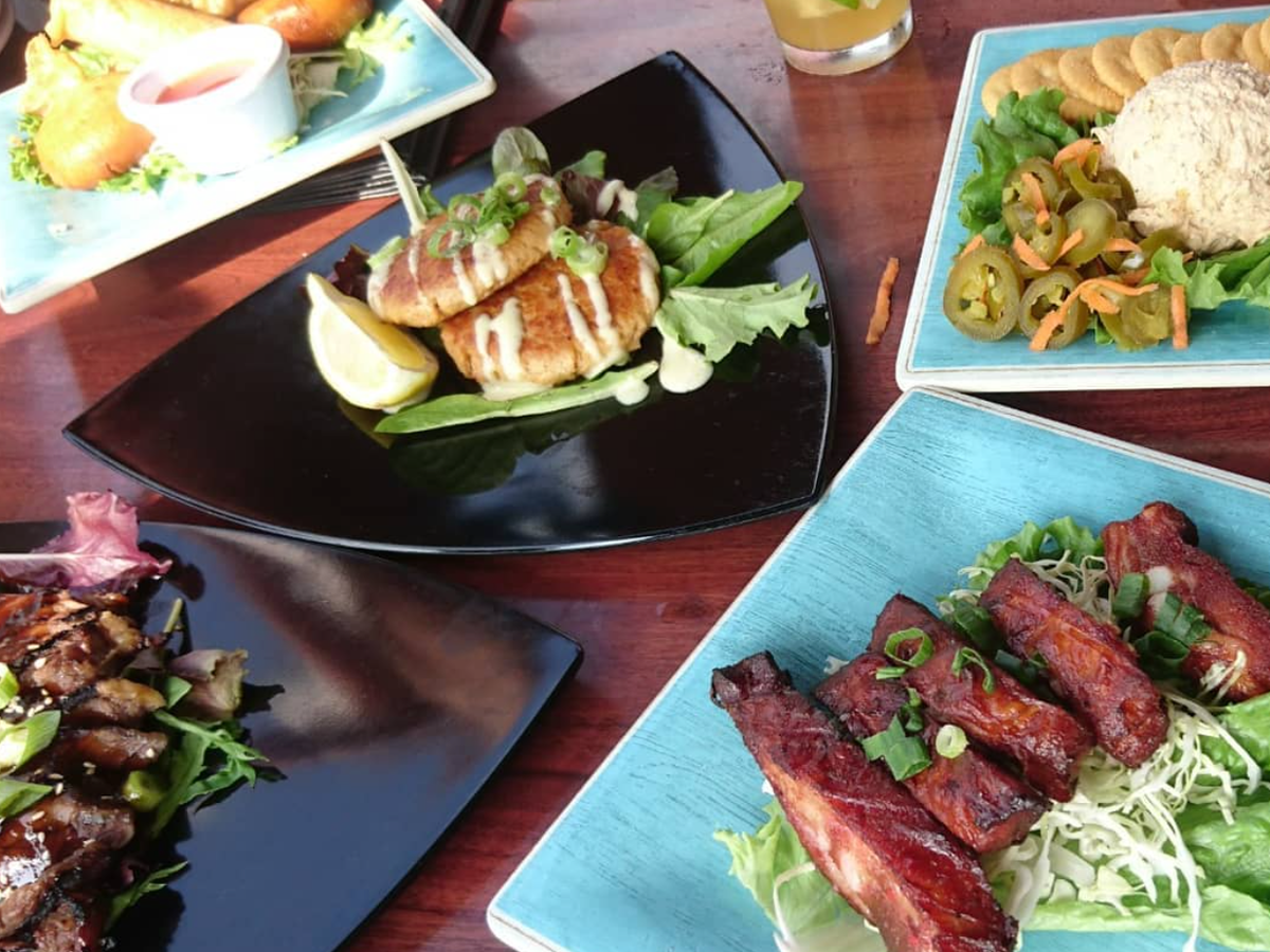 Array of delicious hawaiian plates on table at restaurant