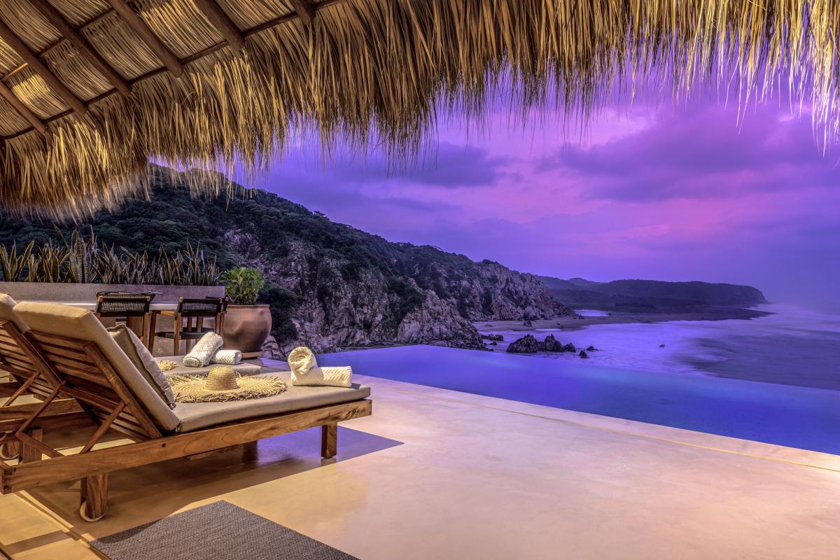 Indoor/outdoor living space with sea views.