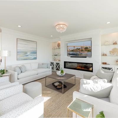 Living room with fireplace and ocean views.