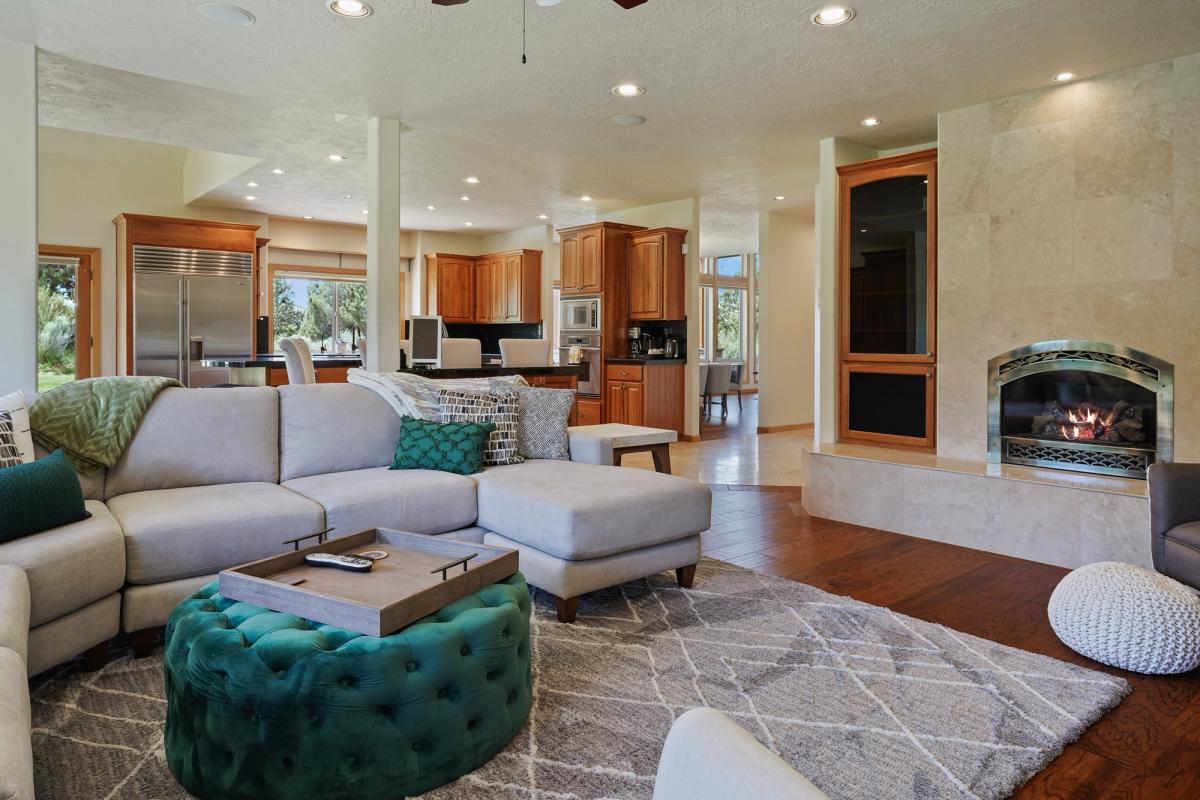 Interior living space with fireplace in a Bend, OR vacation rental.