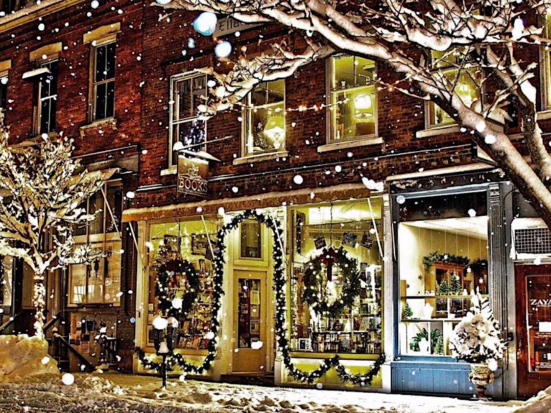 Shops in Woodstock, VT At Christmas Time While Snowing