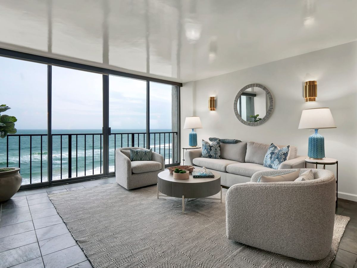 Modern oceanfront condo with sleek decor and a cozy balcony overlooking the waves. A perfect choice for couples or small families wanting a relaxing coastal escape.