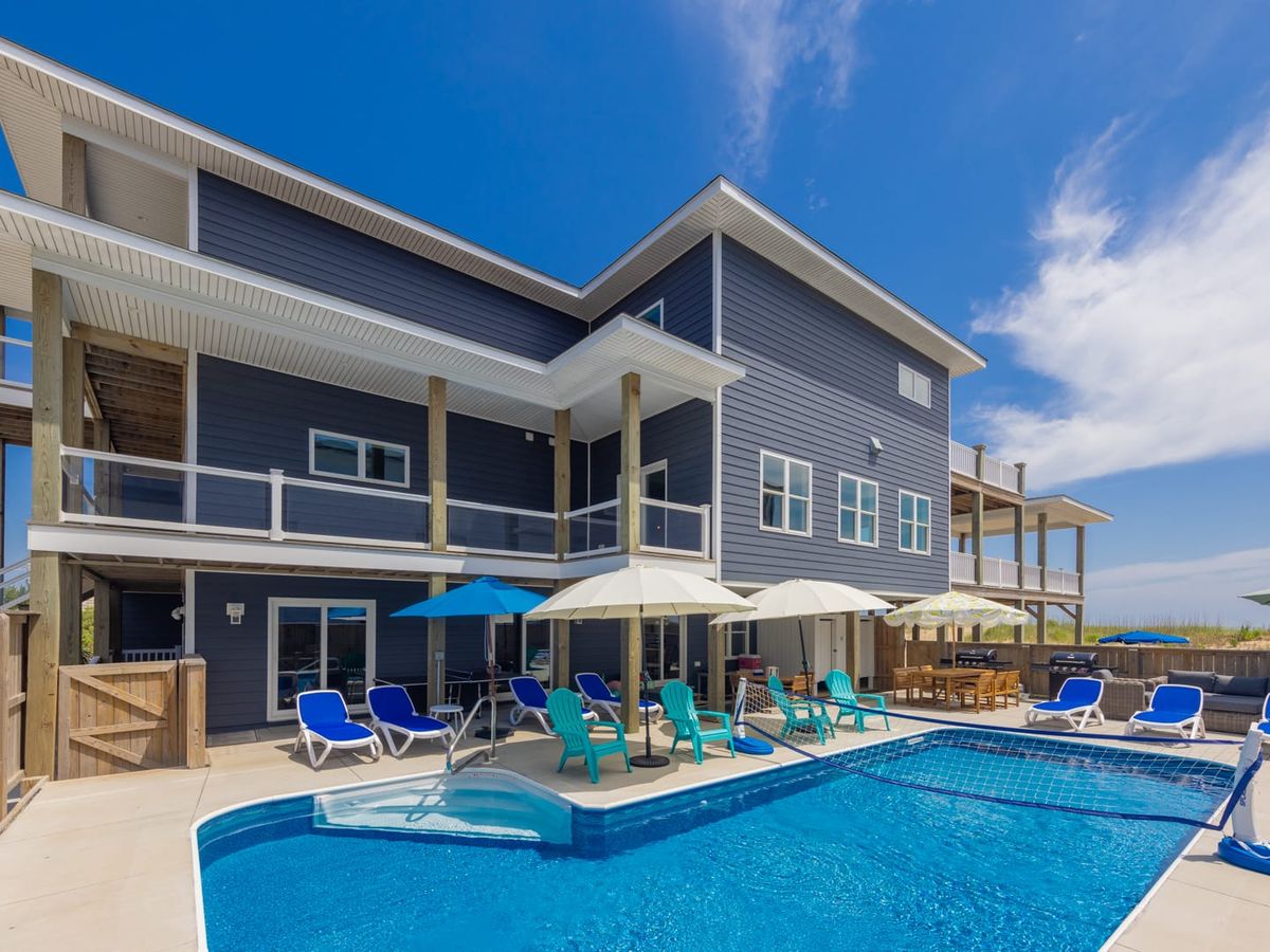 Elegant beachfront rental with a large pool, poolside seating, and incredible coastal views. Offers plenty of room for big groups to relax and enjoy the ocean breeze.