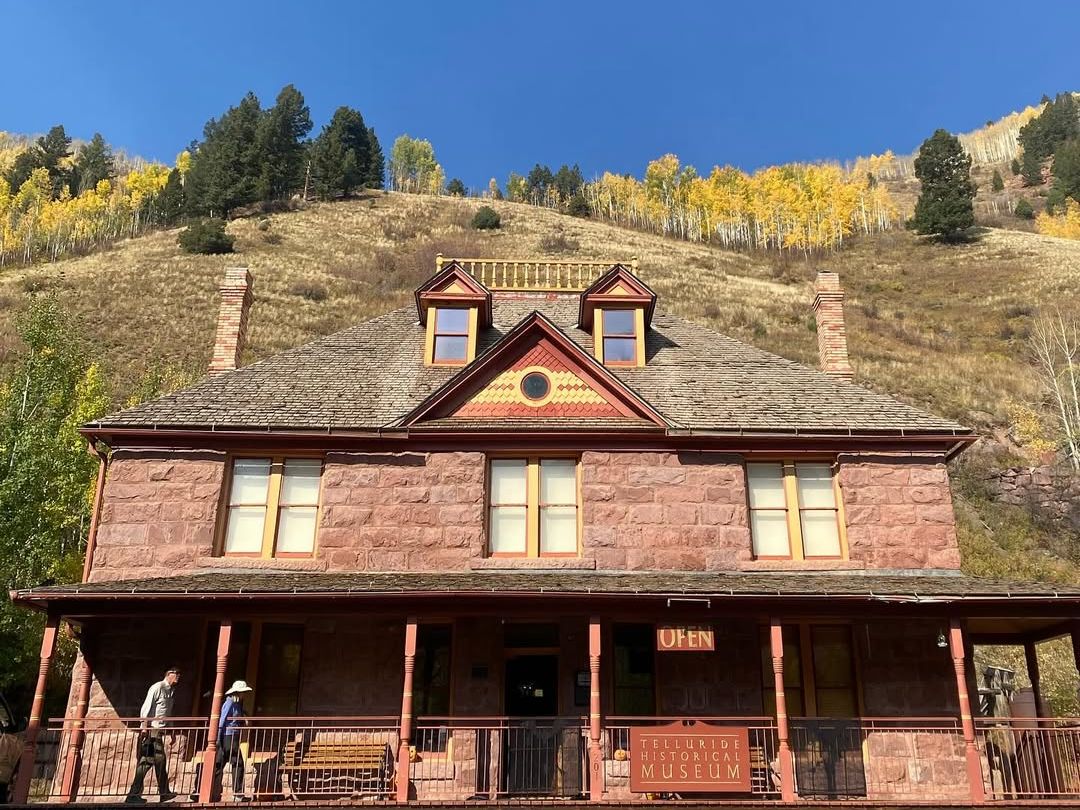 The Telluride Historical Museum sits on a hill backed by golden fall trees, housed in a red-brick building from the mining era. A great stop for learning about Telluride’s rich history.