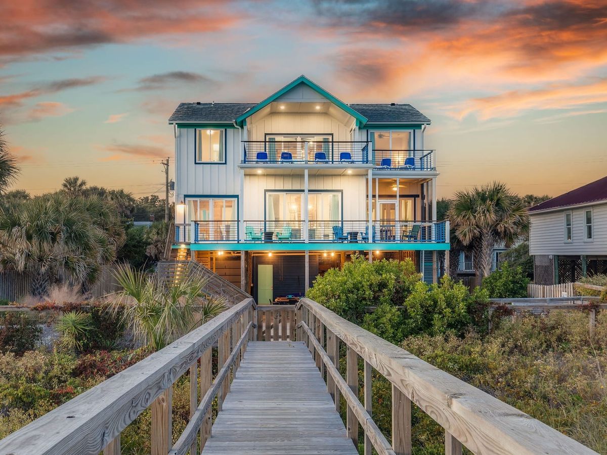 Sursea is a dreamy oceanfront escape with vibrant sunset skies, wraparound balconies, and direct beach access—ideal for families or large groups.